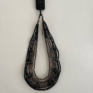 Beaded collar style necklace. Adjustable.